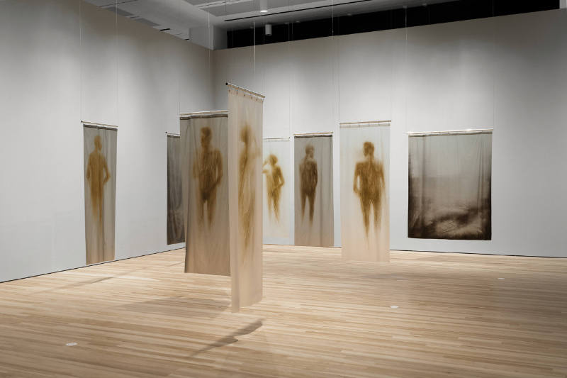 Installation view of "Oscar Muñoz: Invisibilia," Blanton Museum of Art, The University of Texas…